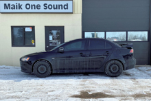 Black 2015 Mitsubishi Lancer with custom wheels and window tint